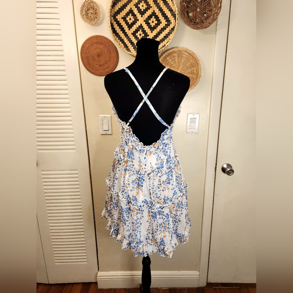 LAST ONE! Blue And White Floral Mini Dress With Ruffles And Criss-Cross Back - Picture 8 of 11